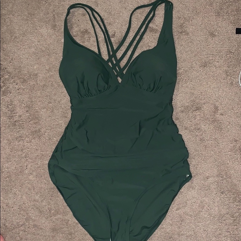 Green plus size one piece w criss cross back
